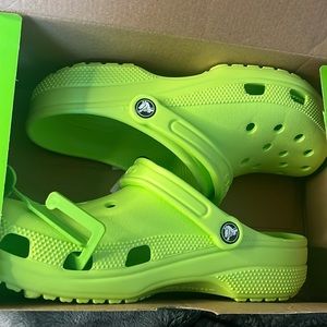 Green crocs never worn. Size 9 in men. Comes with new box